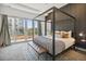 Relax in this main bedroom with modern decor, ample natural light, and a sliding glass door to a balcony at 1711 Boulder St, Denver, CO 80211