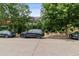 Street with parked cars and trees with the 'Bamboo' sign visible in the background at 1711 Boulder St, Denver, CO 80211