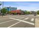 Street view featuring 'The Post' restaurant at a crosswalk and adjacent buildings at 1711 Boulder St, Denver, CO 80211