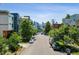 Street view with downtown skyline in the background behind the trees at 1711 Boulder St, Denver, CO 80211