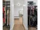 Bright walk-in closet with built-in shelving and ample storage for clothes and accessories at 1711 Boulder St, Denver, CO 80211