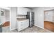 Kitchen with stainless steel refrigerator and granite counters at 81 S Chase Dr, Lakewood, CO 80226