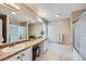 Spacious bathroom with double sink vanity, large mirror, and a glass-enclosed shower at 1824 Morningview Ln, Castle Rock, CO 80109