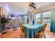 Open dining area featuring hardwood floors, stylish lighting, and connection to kitchen at 1824 Morningview Ln, Castle Rock, CO 80109