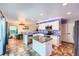 Modern kitchen with granite countertops, stainless steel appliances, and tile flooring at 1824 Morningview Ln, Castle Rock, CO 80109