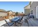 Outdoor patio area featuring a table set with seating for six and a grill at 1824 Morningview Ln, Castle Rock, CO 80109