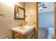 Well-lit bathroom showcasing a stylish sink and vanity, with a view into the adjacent bedroom for a convenient layout at 10956 Osprey Ct, Parker, CO 80134