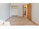 A bedroom with an open closet and carpet flooring is ready for customization at 10956 Osprey Ct, Parker, CO 80134