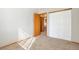 A neutral bedroom features carpet flooring, a closet, and natural light at 10956 Osprey Ct, Parker, CO 80134