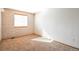 Neutral bedroom featuring a brick accent wall and carpet flooring at 10956 Osprey Ct, Parker, CO 80134
