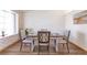 Inviting dining space with wood floors, a contemporary table setting, and a charming window view at 10956 Osprey Ct, Parker, CO 80134