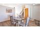 Bright dining area featuring modern floors, a stylish table set for four, and stairway at 10956 Osprey Ct, Parker, CO 80134