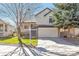 Charming two-story home featuring a two-car garage and well-maintained front yard in a peaceful neighborhood at 10956 Osprey Ct, Parker, CO 80134
