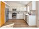 Bright kitchen with stainless steel appliances, white cabinets, and plenty of counter space, perfect for cooking at 10956 Osprey Ct, Parker, CO 80134