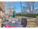 Spacious backyard featuring a patio area with a grill, perfect for outdoor dining and relaxation at 13742 W 67Th Pl, Arvada, CO 80004