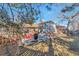 Private backyard with a deck, outdoor seating, and lush greenery, perfect for entertaining or relaxing at 13742 W 67Th Pl, Arvada, CO 80004