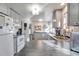 Bright kitchen with modern grey cabinets, stainless steel appliances, and ample counter space for cooking at 13742 W 67Th Pl, Arvada, CO 80004