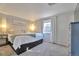Serene main bedroom with plush bedding, ambient lighting, and light gray walls at 13742 W 67Th Pl, Arvada, CO 80004