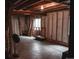 Unfinished basement awaiting your vision with exposed wood beams and concrete floors at 11384 Oakland Dr, Commerce City, CO 80640