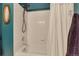 Clean bathroom with a shower-tub combo with white tile and a shower curtain at 11384 Oakland Dr, Commerce City, CO 80640