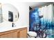 This is a stylish bathroom featuring a pirate themed shower curtain and modern vanity at 1543 S Ouray Cir # B, Aurora, CO 80017