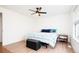 Bright bedroom with a ceiling fan, laminate flooring, and comfortable bed at 1543 S Ouray Cir # B, Aurora, CO 80017