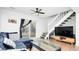 Bright living room with hardwood floors, ceiling fan, and a sliding glass door to the outside at 1543 S Ouray Cir # B, Aurora, CO 80017