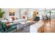 Spacious open-concept living room connecting to kitchen and dining areas with modern decor at 7603 W Coal Mine Pl, Littleton, CO 80128