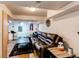 Finished basement includes a stylish bar area and comfortable seating around leather couches at 4889 S Elkhart Ct, Aurora, CO 80015