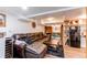 Finished basement features a comfortable seating area and a modern kitchenette at 4889 S Elkhart Ct, Aurora, CO 80015