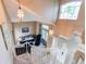 Inviting foyer with pendant lighting, staircase and a glimpse of the living room at 4889 S Elkhart Ct, Aurora, CO 80015
