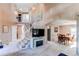 Grand foyer featuring high ceilings, a staircase, and views into the dining and living areas at 4889 S Elkhart Ct, Aurora, CO 80015