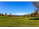Picturesque view of vast green space and mountains, creating a serene and scenic backdrop at 4889 S Elkhart Ct, Aurora, CO 80015