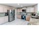 Spacious kitchen with stainless steel appliances and granite countertops at 4889 S Elkhart Ct, Aurora, CO 80015