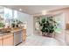 Bright kitchen nook with large windows and granite countertops at 4889 S Elkhart Ct, Aurora, CO 80015