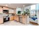 Well-lit kitchen with stainless steel appliances and granite countertops at 4889 S Elkhart Ct, Aurora, CO 80015