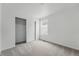 Bedroom with neutral carpet and a closet with a sliding door at 2116 Chambers Rd, Brighton, CO 80601