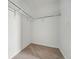 Empty walk-in closet with carpet flooring and a clothes rack at 2116 Chambers Rd, Brighton, CO 80601