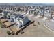 An aerial view of the neighborhood with several homes featuring solar panels on their roofs at 10554 Casper Pt, Parker, CO 80134