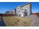 Large backyard with a deck, shed, and mature landscaping is perfect for entertaining guests at 10554 Casper Pt, Parker, CO 80134