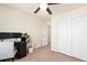 Neutral bedroom with a modern computer setup and closet offering both style and functionality at 10554 Casper Pt, Parker, CO 80134