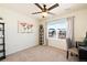 Bedroom with a ceiling fan, neutral walls, and a large window with neighborhood views at 10554 Casper Pt, Parker, CO 80134