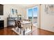 Bright dining area features hardwood floors, backyard views through a sliding glass door, and modern decor at 10554 Casper Pt, Parker, CO 80134
