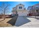 Charming two-story home with a well-manicured lawn and a two-car garage at 10554 Casper Pt, Parker, CO 80134