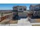 Inviting two-story home with a two-car garage, covered porch, and mature landscaping at 10554 Casper Pt, Parker, CO 80134