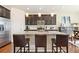 Modern kitchen with granite countertops, stainless steel appliances, and a stylish breakfast bar at 10554 Casper Pt, Parker, CO 80134