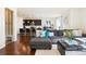 Cozy living area with dark kitchen cabinetry, gray couch, and lots of natural light at 10554 Casper Pt, Parker, CO 80134