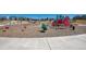A bright and colorful playground with swings, slides, and other fun activities at 10554 Casper Pt, Parker, CO 80134