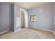 Cozy bedroom with a neutral carpet and a window providing natural light, ideal for rest and relaxation at 2280 S Decatur St, Denver, CO 80219