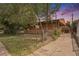 Charming single-story home with a fenced yard and covered front porch, perfect for enjoying outdoor living at 2280 S Decatur St, Denver, CO 80219